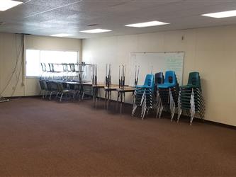 chairs and desks stacked up